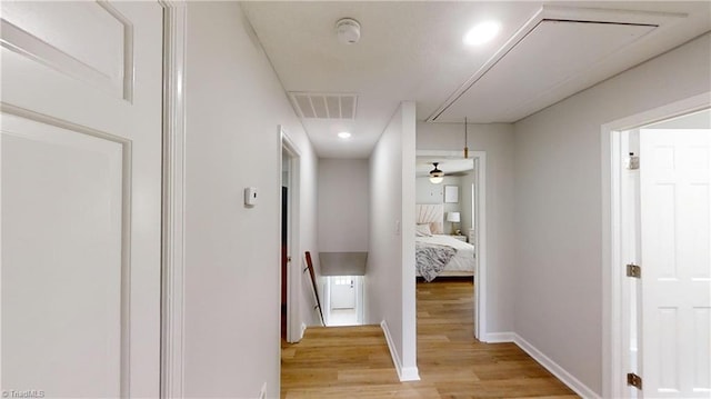 hall with light hardwood / wood-style flooring