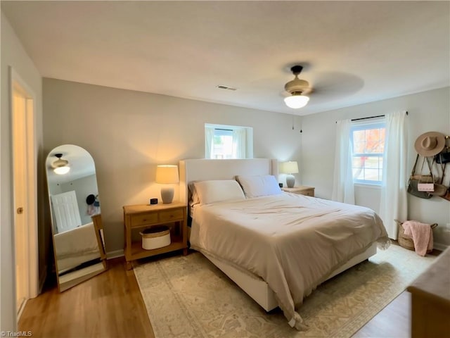 bedroom featuring light wood-type flooring and ceiling fan