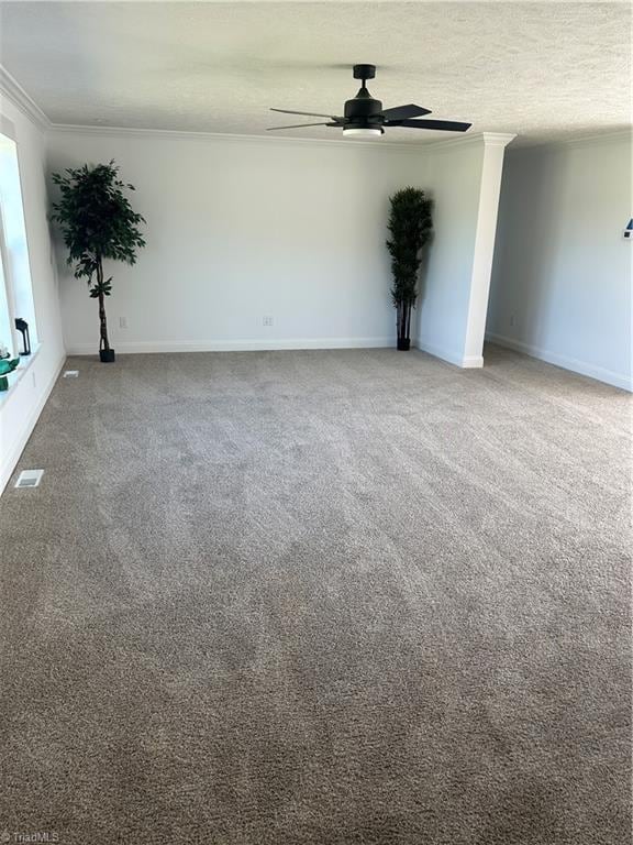 3700 Ireland Rd, Yadkinville, NC 27011 - empty room with ornamental molding, a ceiling fan, carpet floors, and baseboards