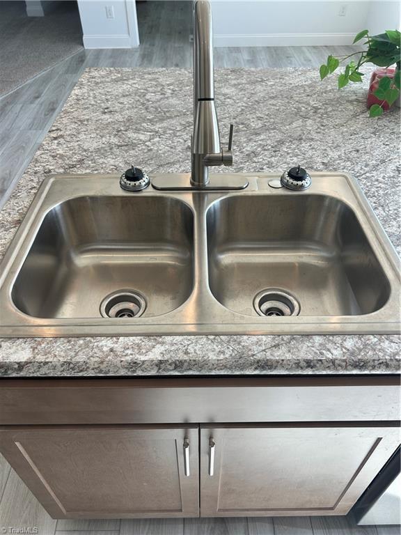 3700 Ireland Rd, Yadkinville, NC 27011 - kitchen view of a sink and wood finished floors
