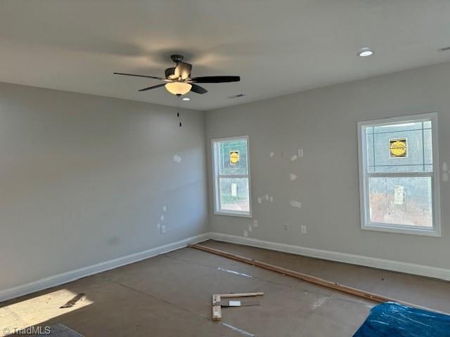 spare room with ceiling fan