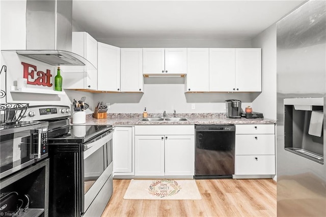 1126 E Springfield Rd, High Point, NC 27263 - kitchen with stainless steel appliances, a sink, wall chimney range hood, and white cabinets