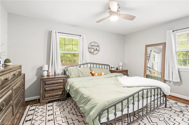 1126 E Springfield Rd, High Point, NC 27263 - bedroom featuring wood finished floors, baseboards, and a ceiling fan