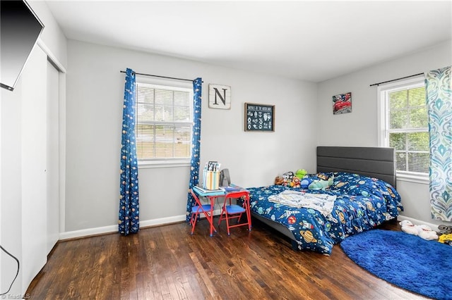 1126 E Springfield Rd, High Point, NC 27263 - bedroom featuring wood finished floors and baseboards