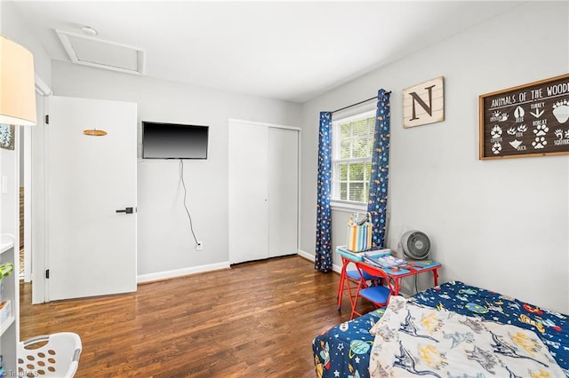 1126 E Springfield Rd, High Point, NC 27263 - bedroom with wood finished floors, baseboards, a closet, and attic access