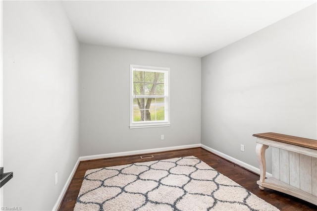 1126 E Springfield Rd, High Point, NC 27263 - spare room with wood finished floors and baseboards