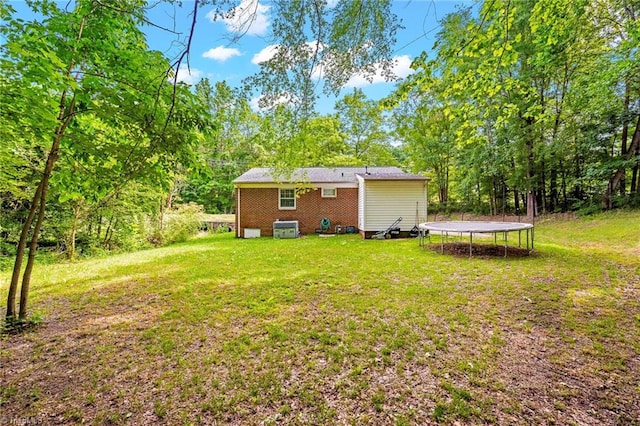 1126 E Springfield Rd, High Point, NC 27263 - view of grassy yard featuring a trampoline