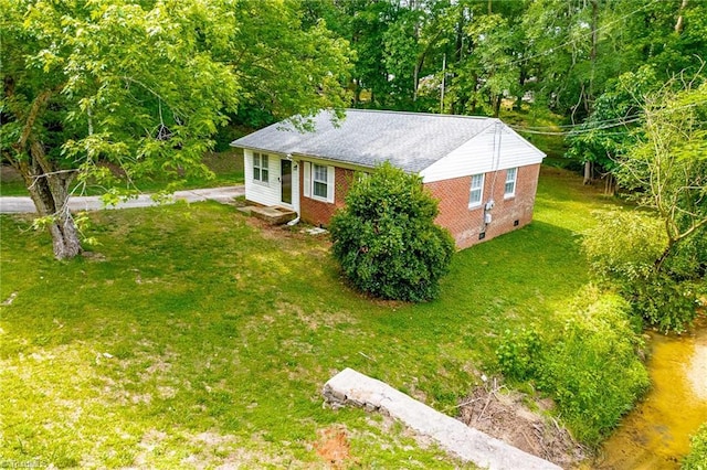 1126 E Springfield Rd, High Point, NC 27263 - view of front of house with brick siding, a front lawn, and crawl space
