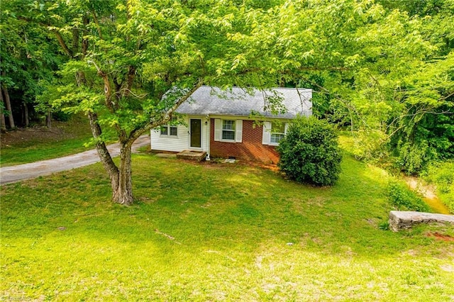 1126 E Springfield Rd, High Point, NC 27263 - view of front of house with asphalt driveway, a front yard, and brick siding
