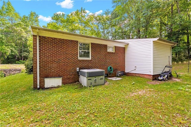 1126 E Springfield Rd, High Point, NC 27263 - back of property featuring central air condition unit and a yard