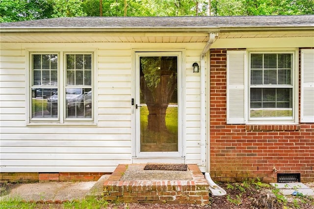 1126 E Springfield Rd, High Point, NC 27263 - entrance to property with crawl space, brick siding, and roof with shingles