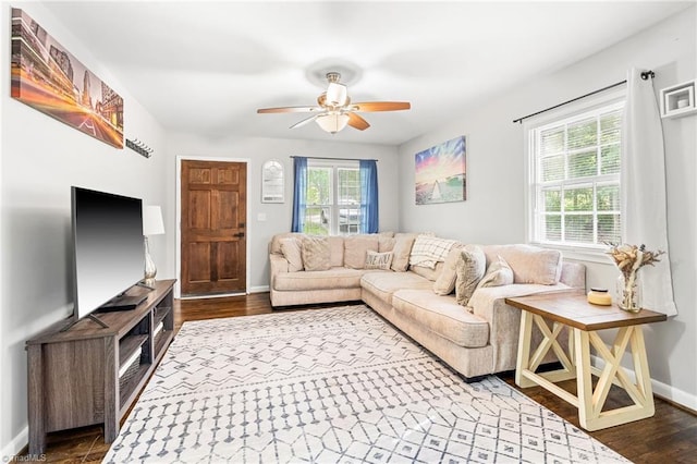 1126 E Springfield Rd, High Point, NC 27263 - living room featuring ceiling fan, baseboards, and dark wood-style flooring