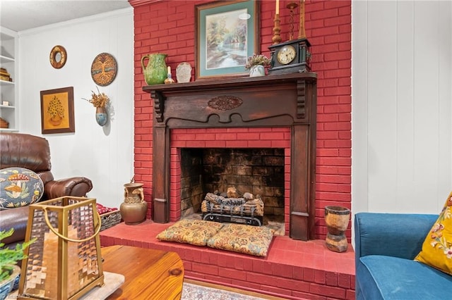 living area featuring crown molding and a fireplace