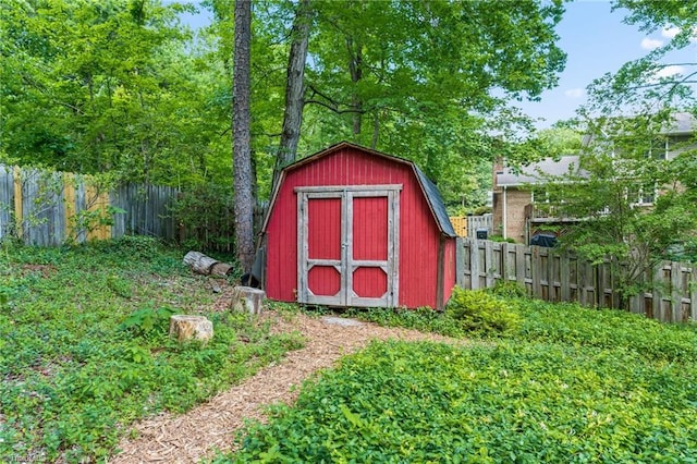 view of shed with a fenced backyard