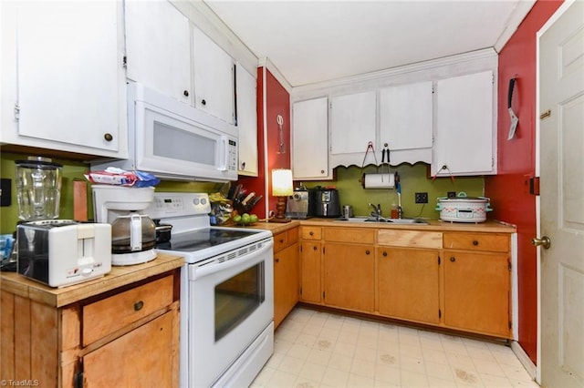 kitchen featuring crown molding, white appliances, sink, and white cabinets