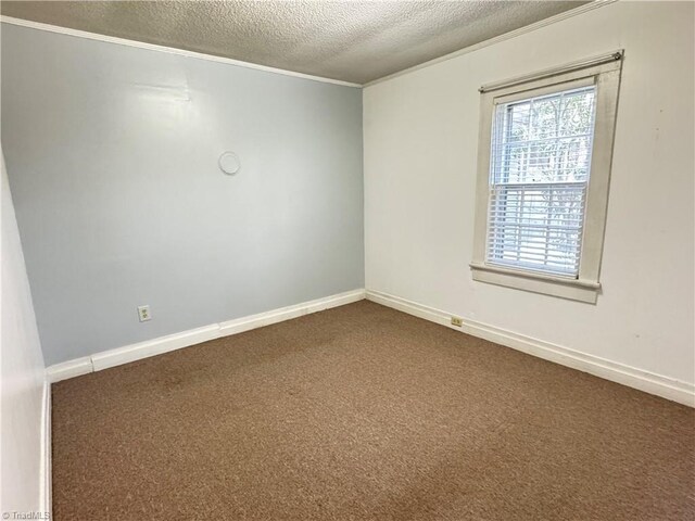 2121/2117 Swan Creek Rd, Jonesville, NC 28642 - empty room featuring dark colored carpet, a textured ceiling, baseboards, and crown molding