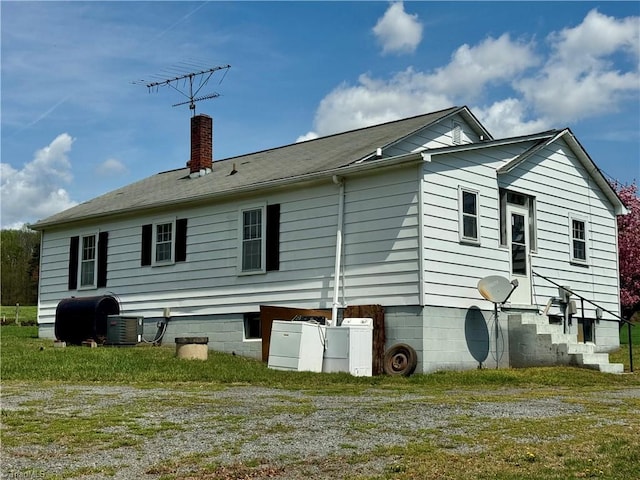 2121/2117 Swan Creek Rd, Jonesville, NC 28642 - rear view of house with heating fuel, central AC, and a chimney