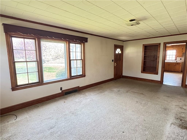 2121/2117 Swan Creek Rd, Jonesville, NC 28642 - carpeted spare room featuring crown molding, baseboards, and visible vents