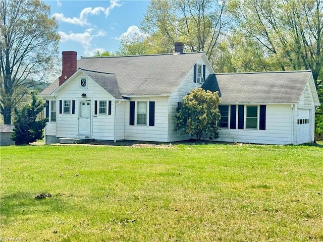 2121/2117 Swan Creek Rd, Jonesville, NC 28642 - view of front facade featuring a shingled roof, a chimney, and a front lawn