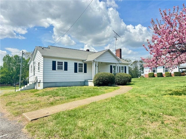 2121/2117 Swan Creek Rd, Jonesville, NC 28642 - view of property exterior with a yard and a chimney