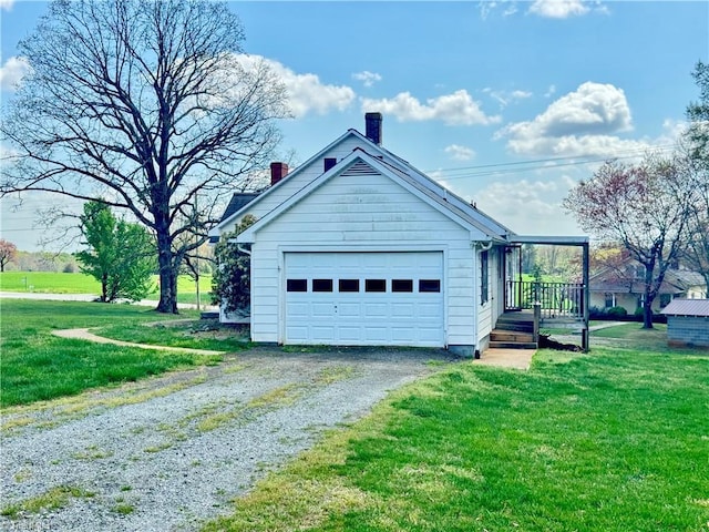 2121/2117 Swan Creek Rd, Jonesville, NC 28642 - view of property exterior featuring a chimney, gravel driveway, and a lawn