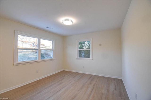 spare room with light wood-type flooring