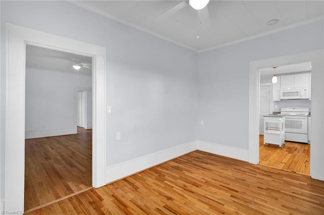 unfurnished room with light wood-type flooring and ornamental molding