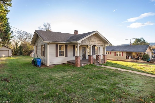 view of front facade with a porch and a front lawn