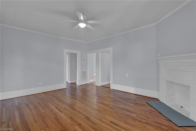 unfurnished living room with ceiling fan, a fireplace, wood-type flooring, and ornamental molding