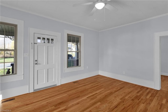 entrance foyer featuring crown molding, ceiling fan, and wood-type flooring