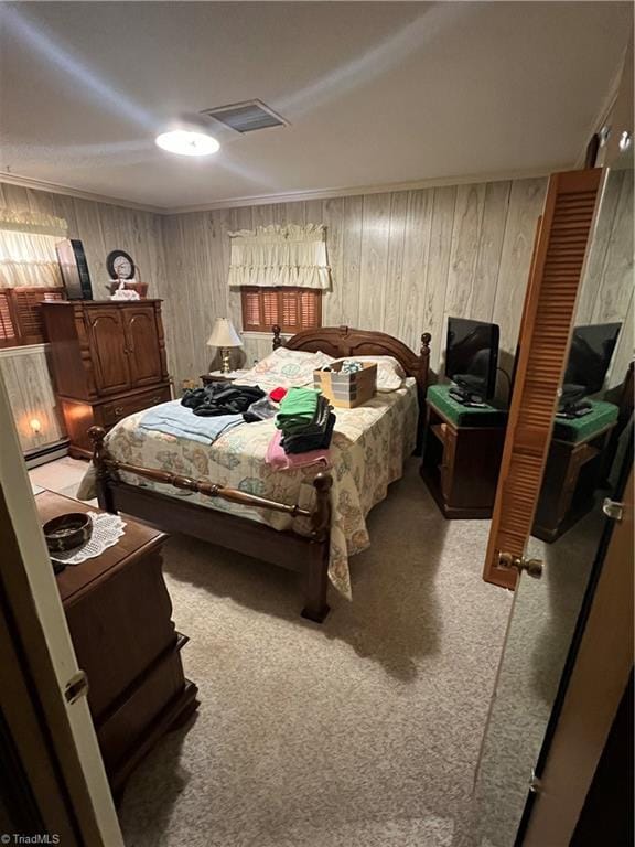 bedroom featuring light colored carpet and visible vents