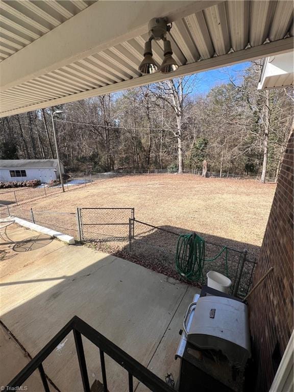 view of patio / terrace featuring a ceiling fan and fence