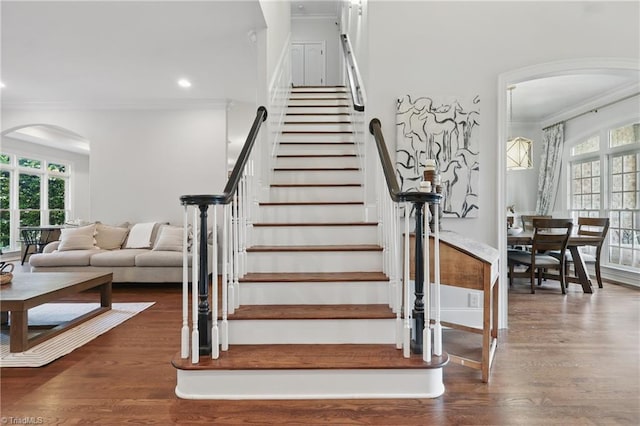 6204 Calendula Ct, Summerfield, NC 27358 - stairway featuring crown molding, arched walkways, wood finished floors, and recessed lighting