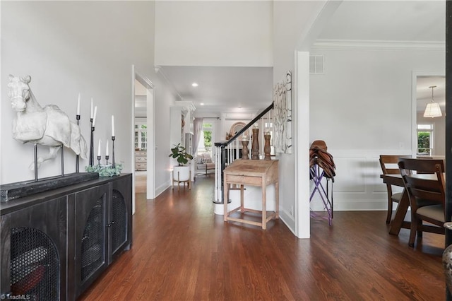 6204 Calendula Ct, Summerfield, NC 27358 - foyer featuring crown molding, plenty of natural light, wood finished floors, stairway, and baseboards