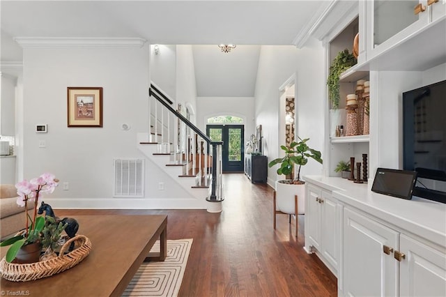 6204 Calendula Ct, Summerfield, NC 27358 - entrance foyer featuring stairway, dark wood-style flooring, ornamental molding, baseboards, and french doors