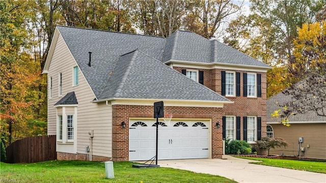 view of front of home featuring a garage and a front yard