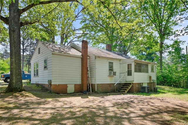 back of property featuring cooling unit