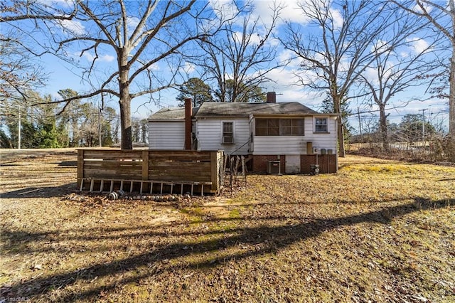 back of property with central air condition unit and a wooden deck