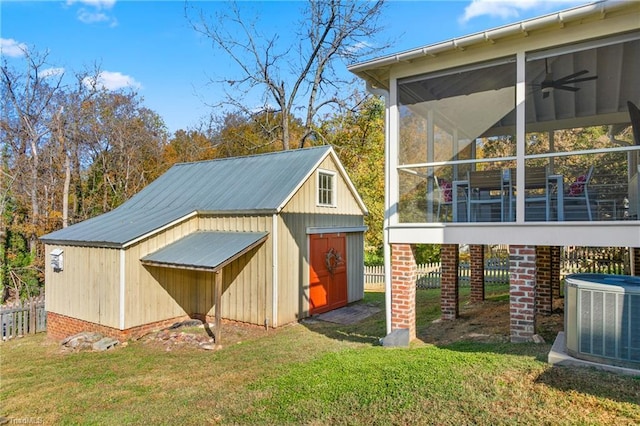 view of shed featuring central air condition unit and a sunroom