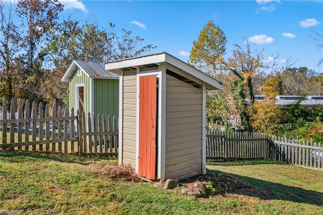 view of shed with a fenced backyard