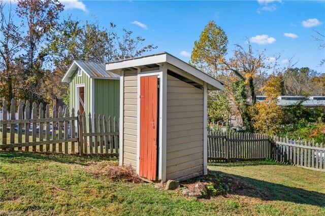 view of shed featuring a fenced backyard