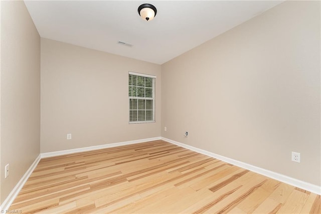 2305 Hartfield Cir, Winston-Salem, NC 27103 - empty room with wood finished floors and baseboards