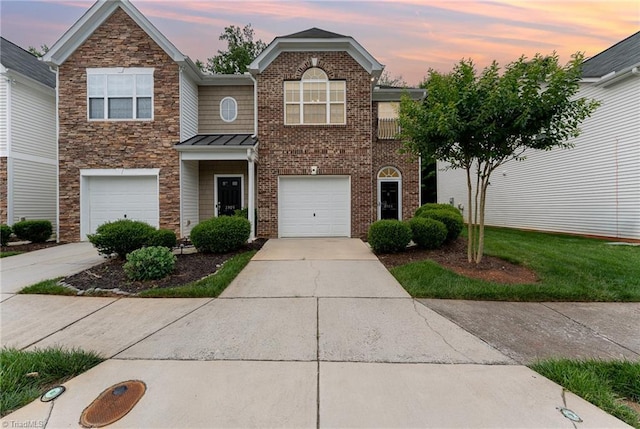 2305 Hartfield Cir, Winston-Salem, NC 27103 - view of front of house featuring concrete driveway, stone siding, a standing seam roof, and an attached garage