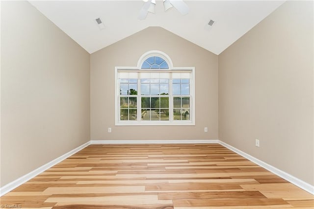 2305 Hartfield Cir, Winston-Salem, NC 27103 - unfurnished room with a ceiling fan, baseboards, wood finished floors, and vaulted ceiling
