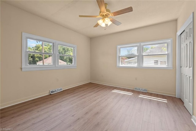 unfurnished room with ceiling fan and light hardwood / wood-style flooring