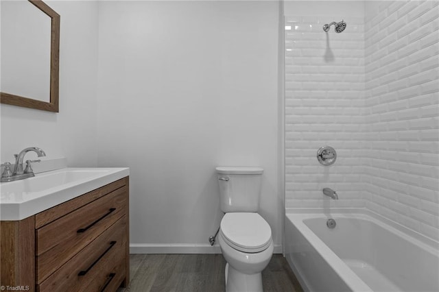 full bathroom featuring tiled shower / bath combo, vanity, toilet, and hardwood / wood-style flooring