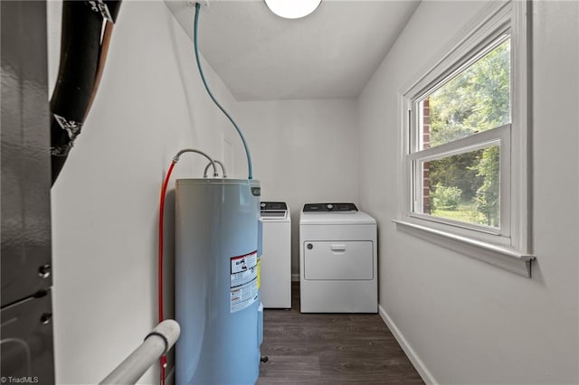 laundry room featuring dark wood-type flooring, independent washer and dryer, and electric water heater