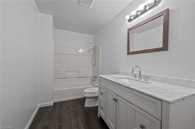 full bathroom featuring vanity, toilet, bathtub / shower combination, and hardwood / wood-style flooring