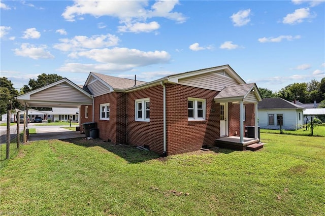 back of house with a yard and central air condition unit