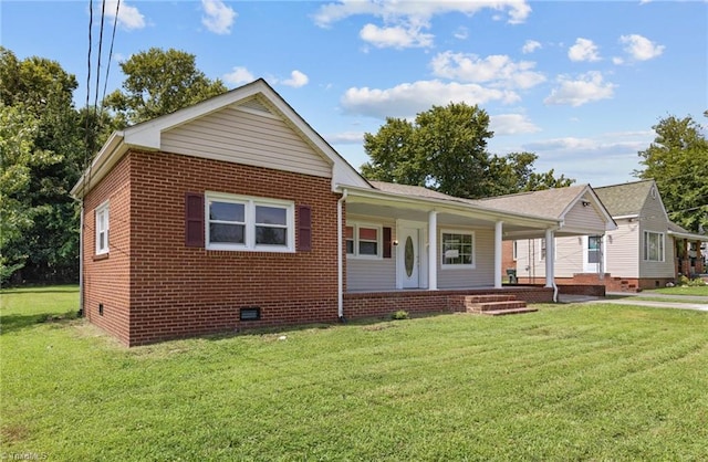 view of front of property with covered porch and a front yard